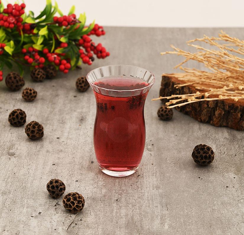 Paşabahçe Rose patterned tea glass filled with tea