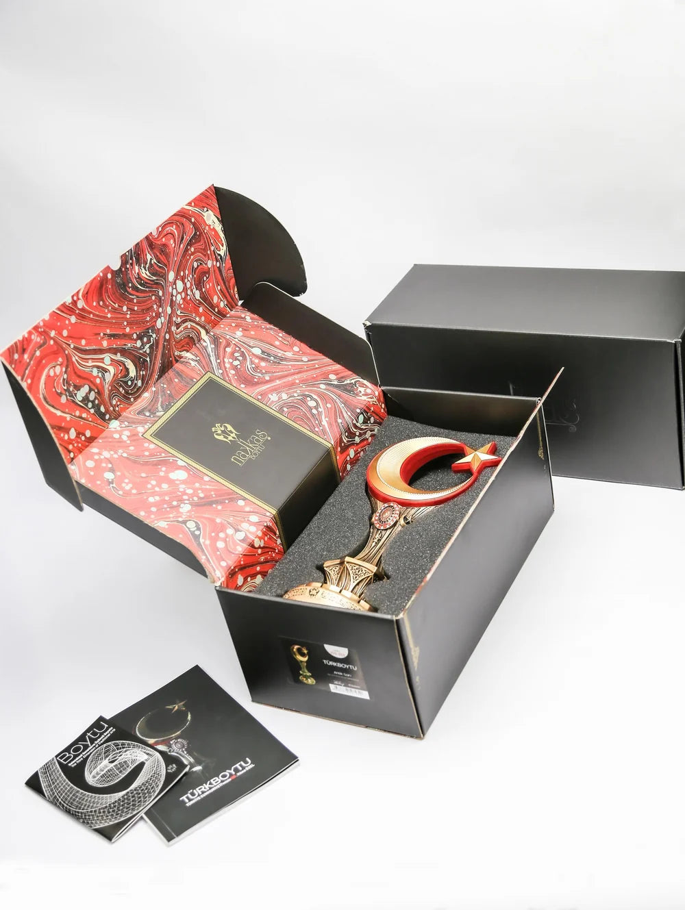 Türkboytu ornament shown in its presentation box
