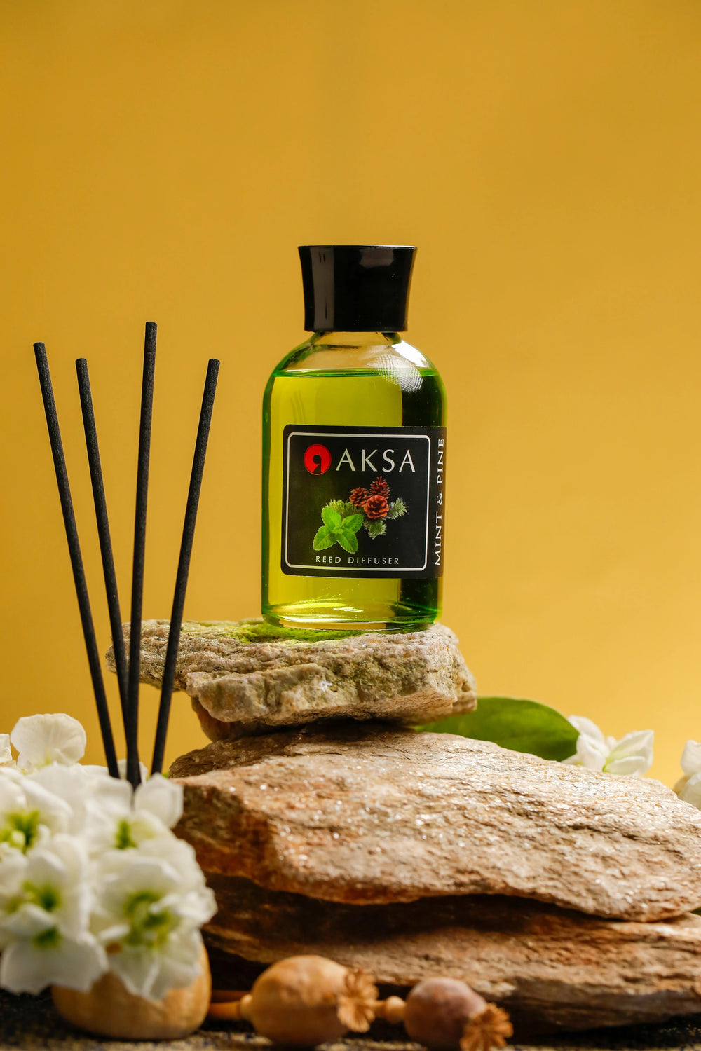 Aksa Mint & Pine fragrance bottle and diffuser reeds