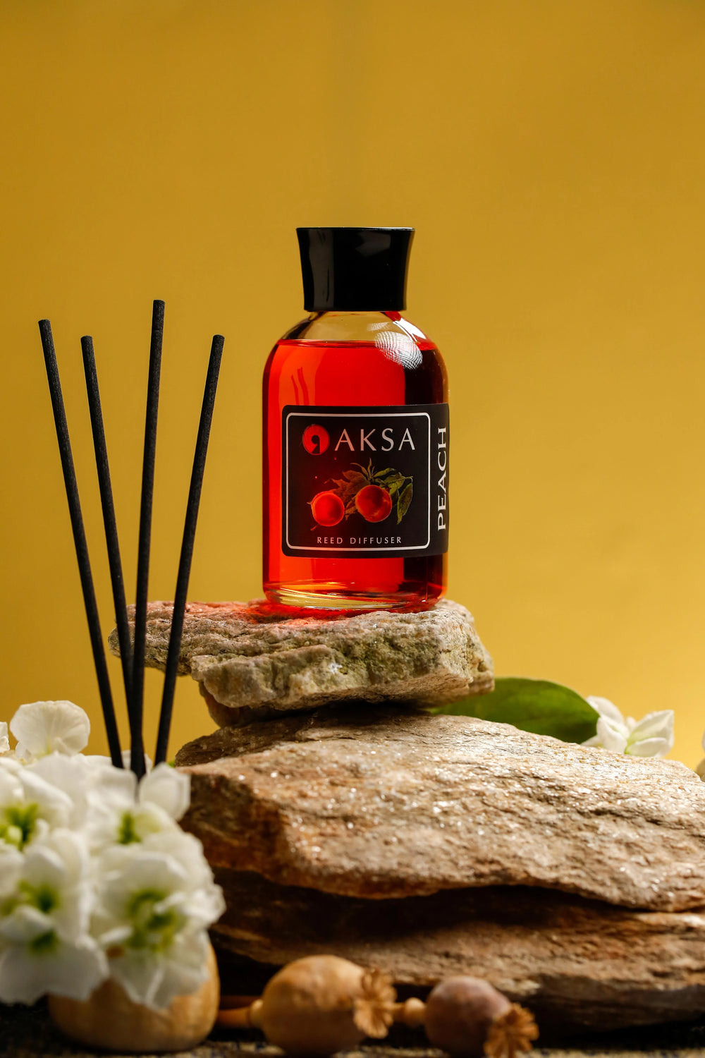 Aksa Peach fragrance bottle and diffuser reeds