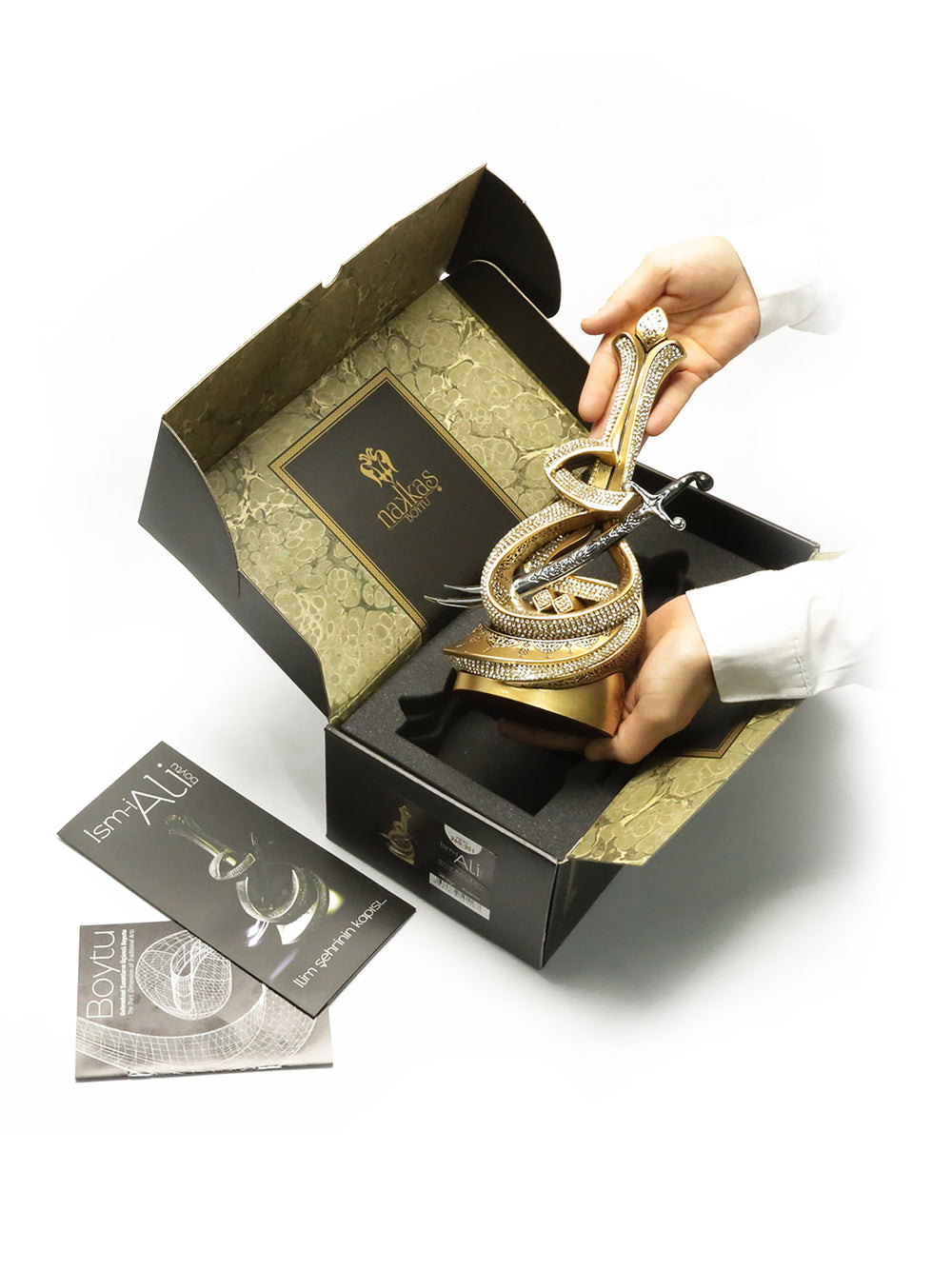 Ism-i Ali ornament shown in its presentation box