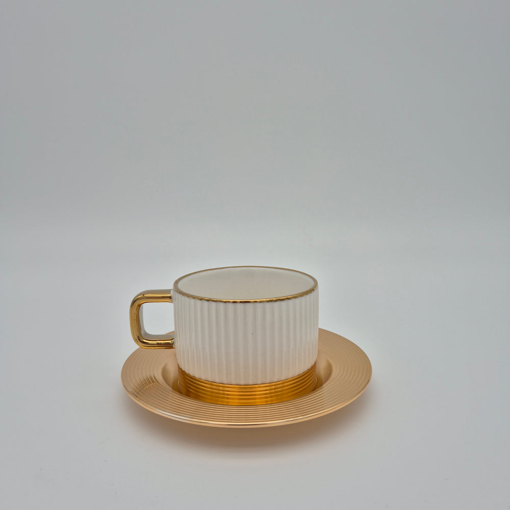White Eylul ribbed coffee cup with gold-coloured saucer