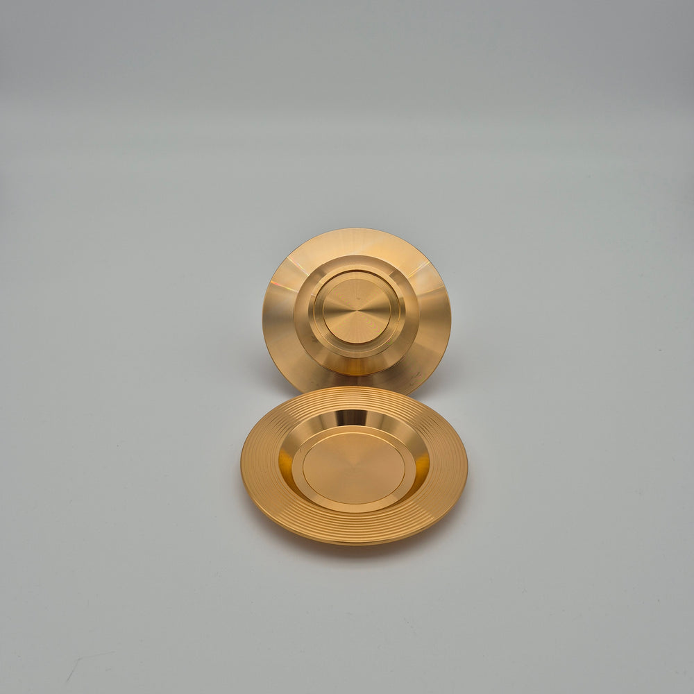 Top and underside views of Eylul gold-coloured saucers