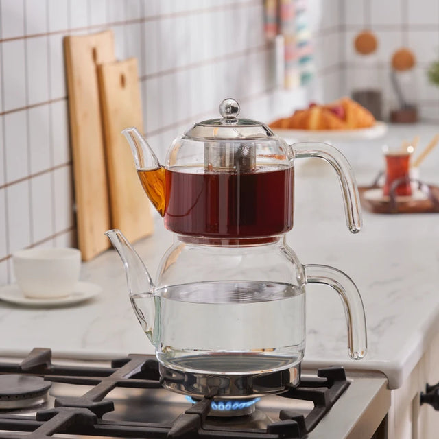 Karaca Panora teapot set shown on a gas cooktop