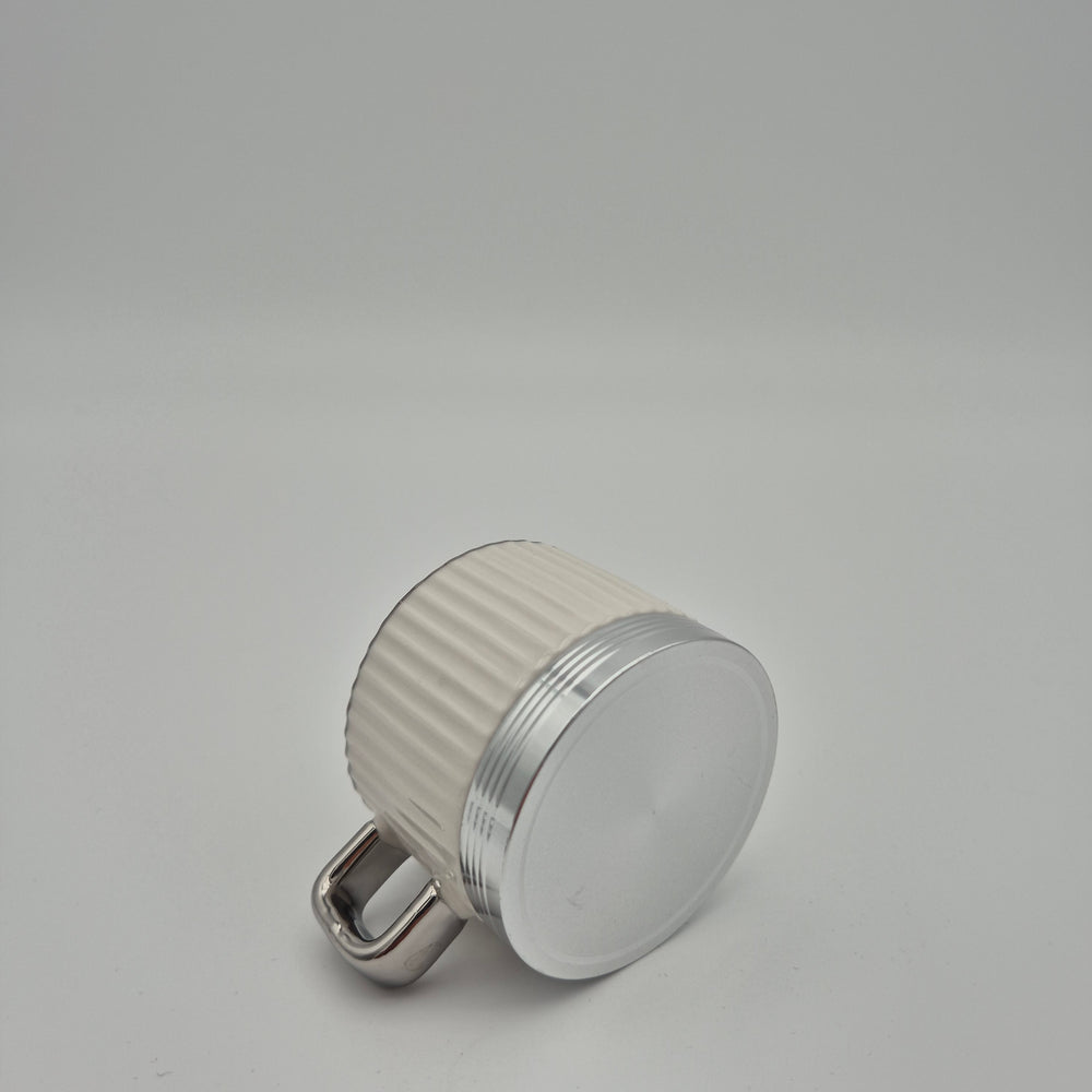 Eylul white cup showing its silver-coloured base