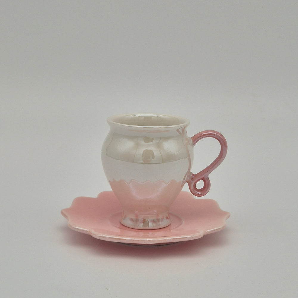 Rear view of Rosey cup with pink handle and saucer