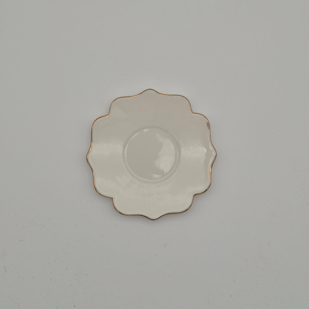 Top view of Flowery petal-edged saucer