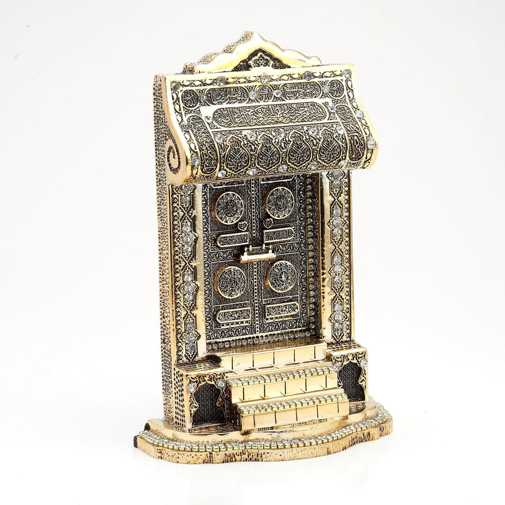 Gold-coloured Kaaba door ornament with a stepped base