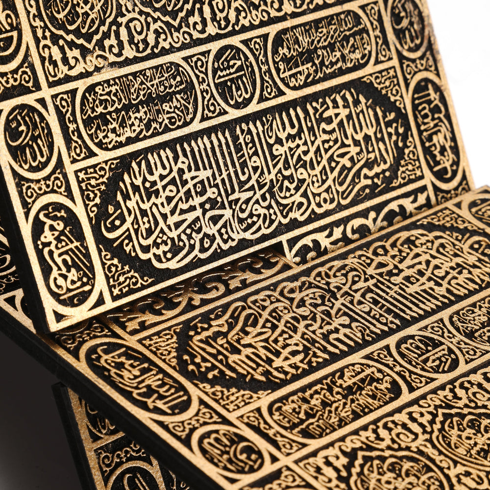 Close-up of the gold-coloured Quran stand calligraphy