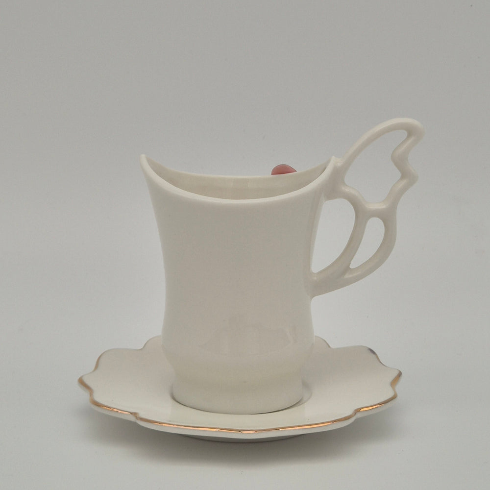 Rear view of Flowery coffee cup and sculpted handle