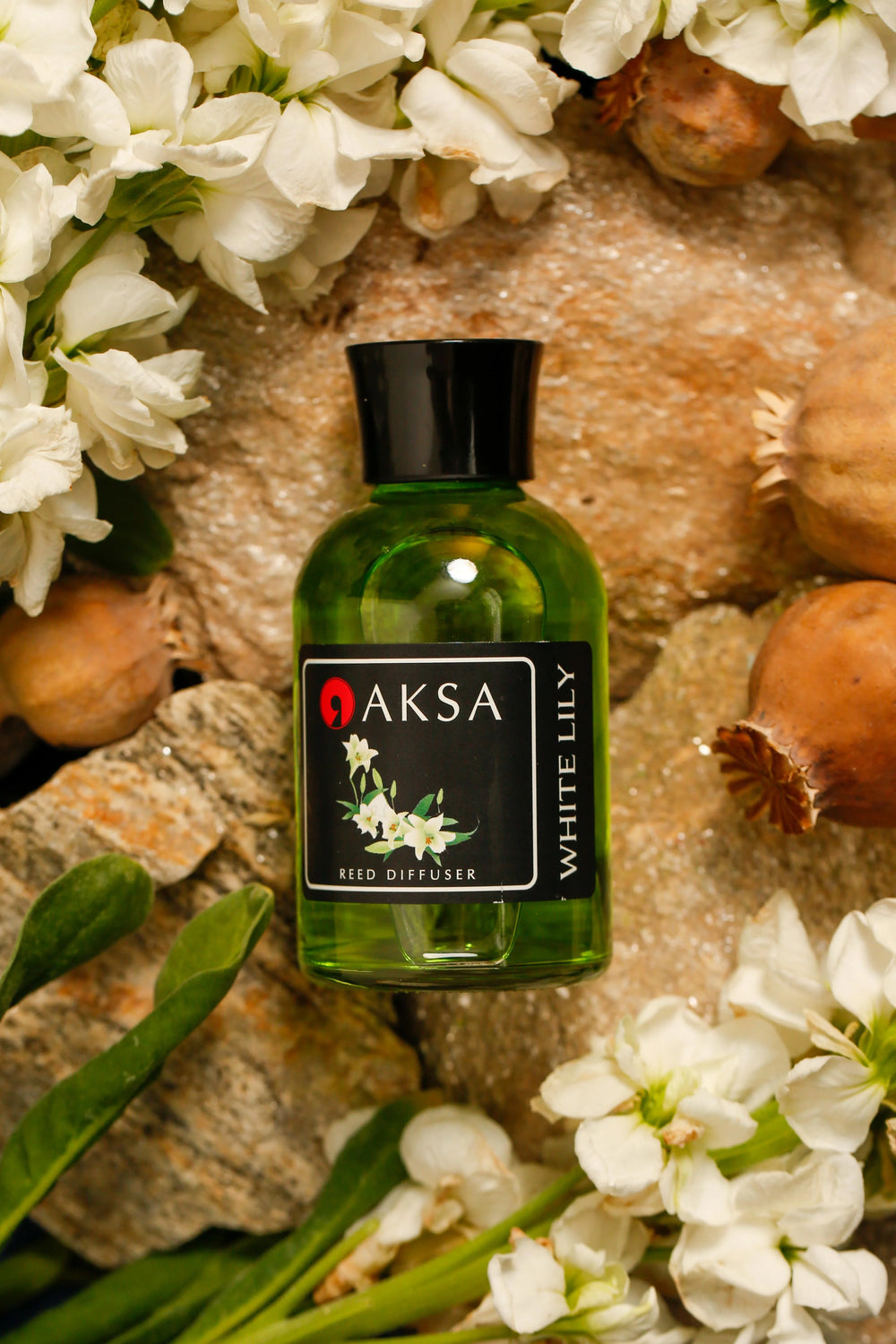 Aksa White Lily fragrance bottle with white flowers