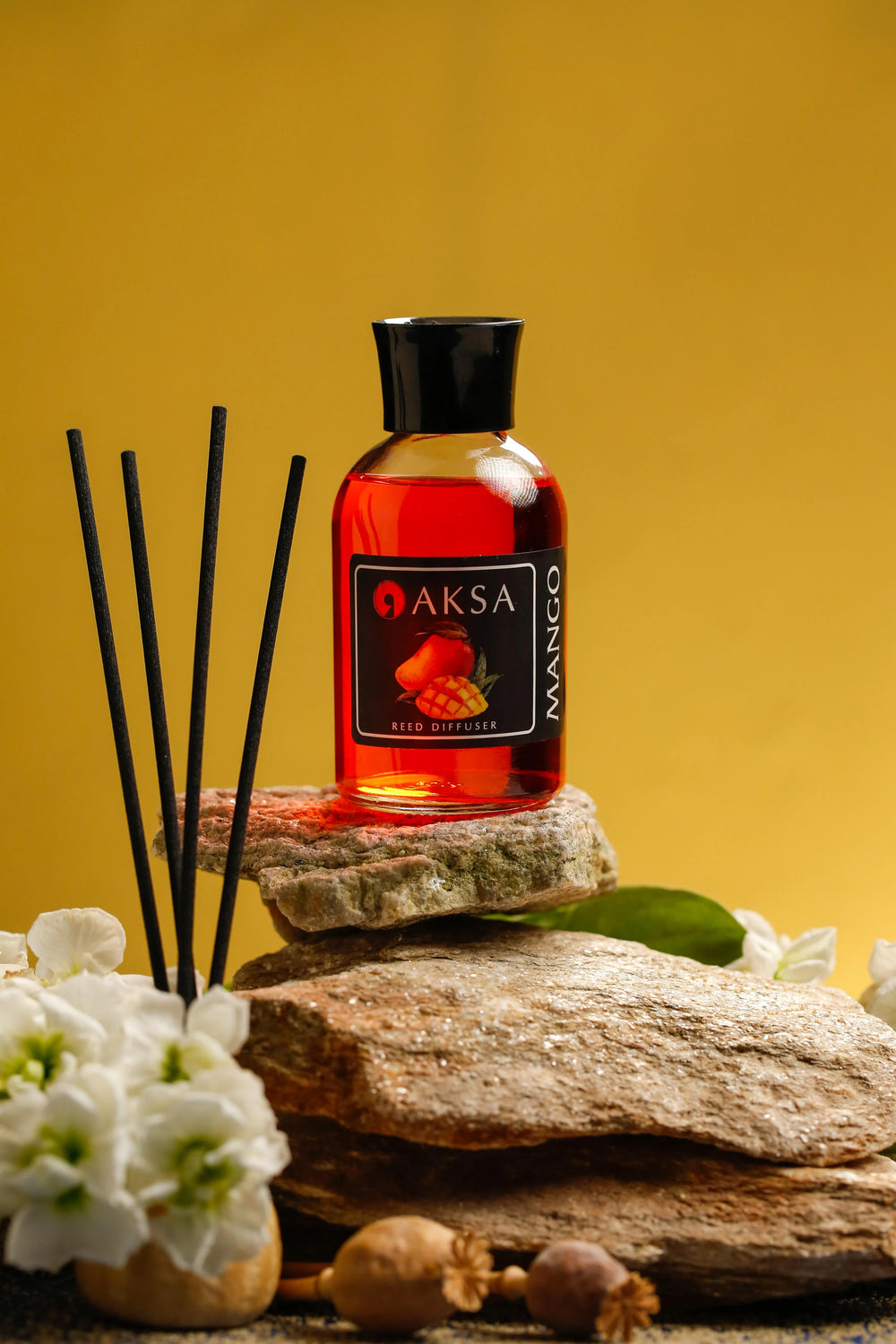 Aksa Mango fragrance bottle and diffuser reeds