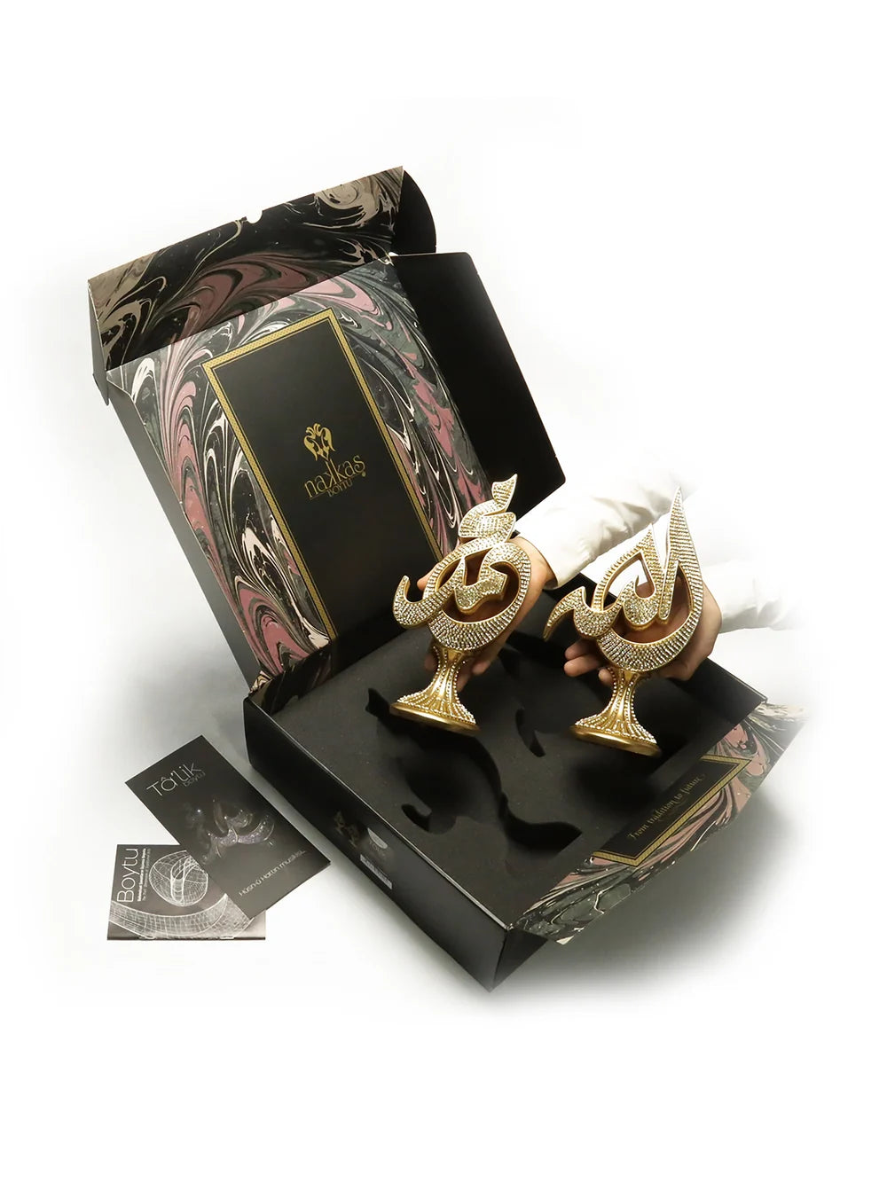 Talik calligraphy ornaments shown in a presentation box